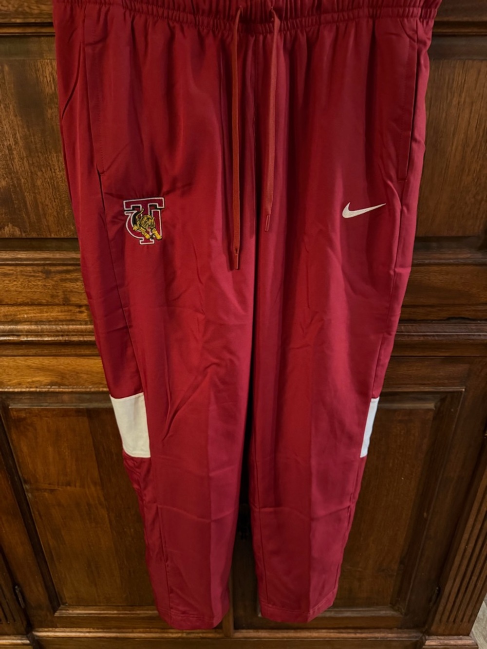 Nike Dry Fit Track Pants with White Swoosh and Tuskegee University Team Patch